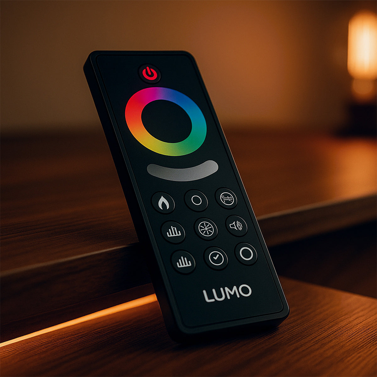 Lumo electric fire Remote control with colorful LED display on a wooden surface