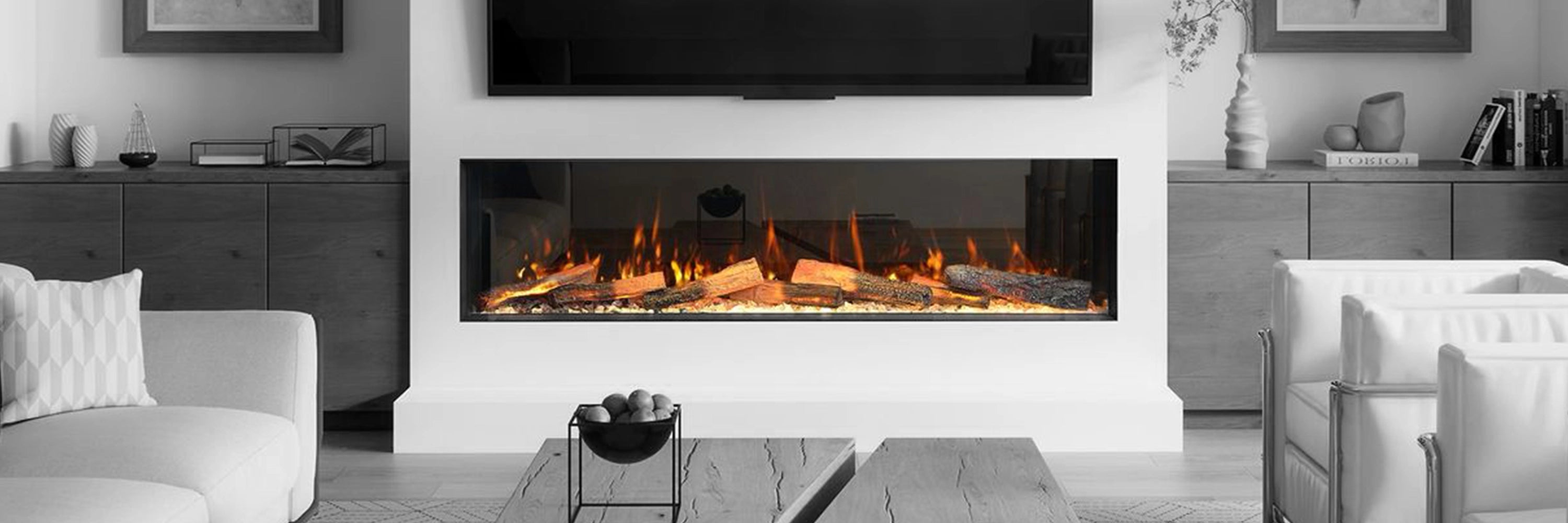 Modern electric fireplace in a living room setting with furniture and decor.